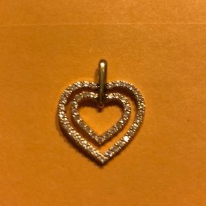 Gold heart pendant with diamond accents